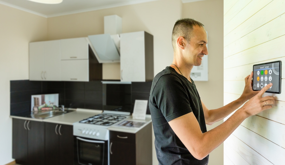 Hand operating a smart home device